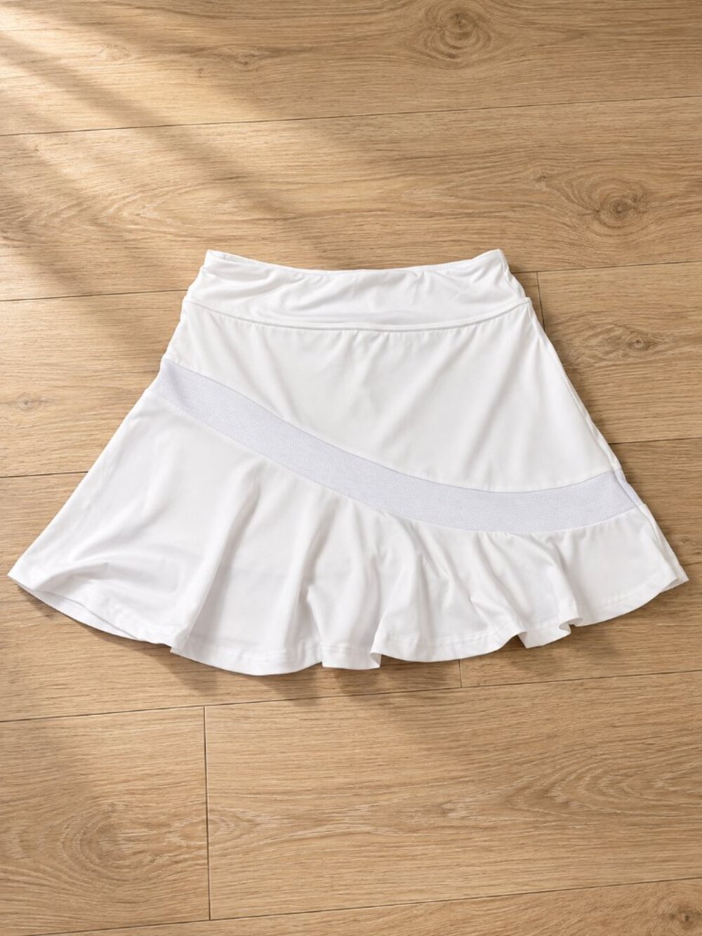 white ruffle tennis skirt, sporty mini with built in shorts, and cute mesh panel